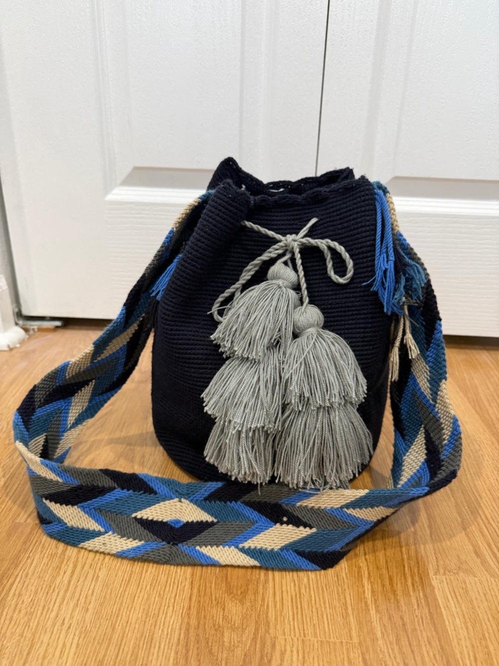 Handmade Navy Woven Bucket Bag with Blue Accent Strap and Gray Tassels